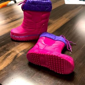 Weather guard pink water proof little girl boots.